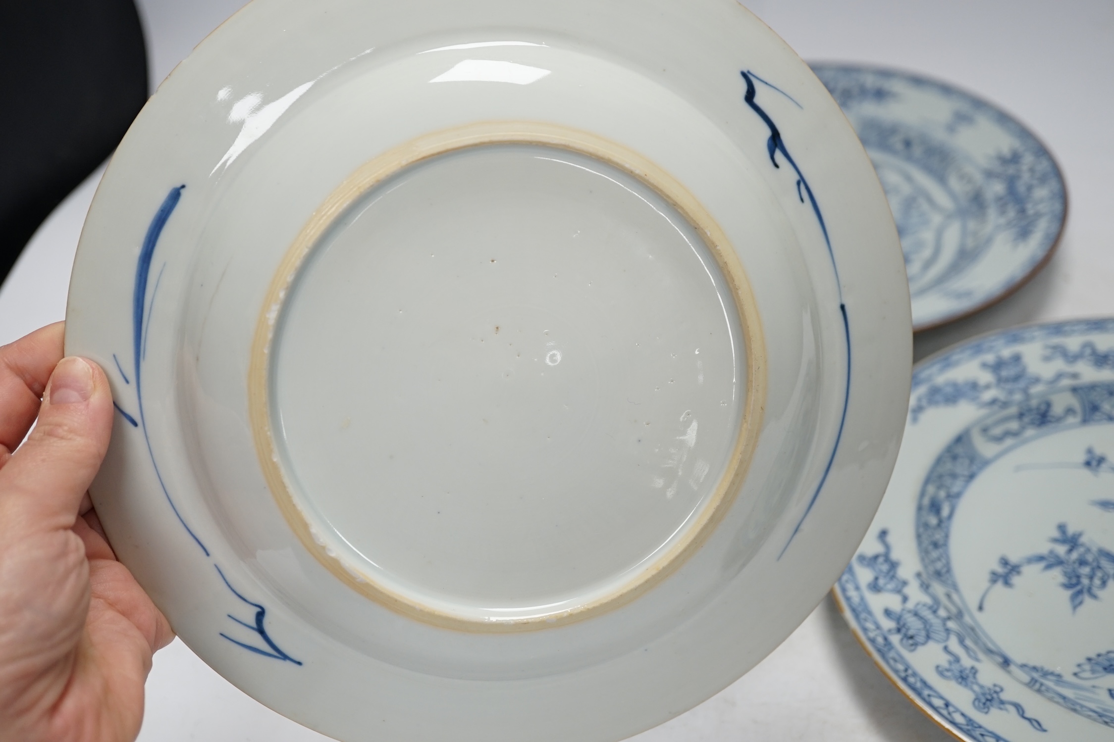 Three Chinese blue and white plates, Yongzheng-Qianlong, 23cm diameter